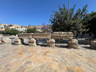 Fototapeta premium Amman, Jordan 25 May 2026: A striking wide-angle shot of the historic Roman Theatre in downtown Amman, Jordan. Built during the 2nd century AD under Emperor Antoninus Pius, this magnificent three-tier