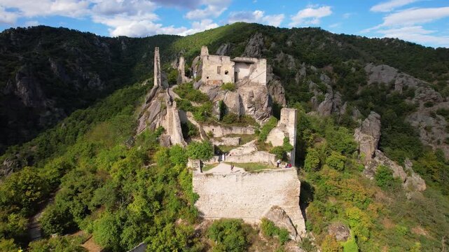 Durnstein Ruined Castle Aerial Drone Orbit Revealing Wachau Valley Danube River Hilltop Fortress in Lower Austria. Medieval Village Skyline Panoramic Travel Destination UNESCO heritage site