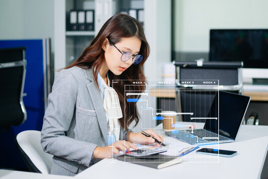 Businesswoman hand Project manager working and update tasks and Gantt chart scheduling virtual diagram.