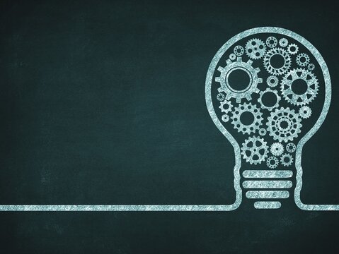 Invention and engineering concept. Chalk drawing of a lightbulb filled with mechanical gears and cogs on a dark green chalkboard texture background with copy space.