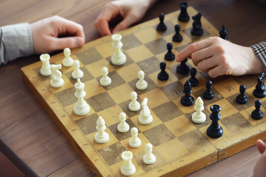 Hand playing game of chess, competition, strategy, battle, play