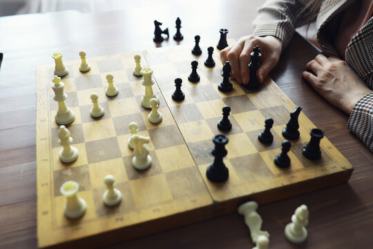 Hand playing game of chess, competition, strategy, battle, play