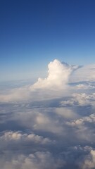 Fototapeta premium Cloud formation in blue sky above fluffy altostratus layer 