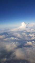 Fototapeta premium Aerial view of fluffy clouds against blue sky during daytime 