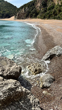 Kraljičina beach coastline with turquoise water and pebbled rocky shore