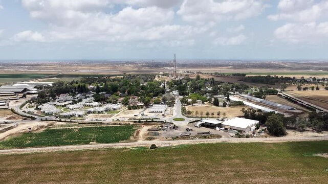 Aerial View Of Nir Oz Near Gaza Border Israel
Drone footage overlooking Nir Oz kibbutz and Shujaiyya Gaza skyline May 26 2026 Israel
