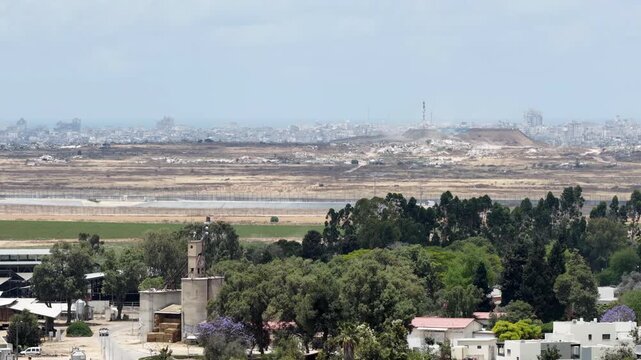 Aerial View Of Nir Oz Border Facing Shujaiyya Gaza
Drone footage showing Nir Oz border fence and Shujaiyya Gaza skyline May 26 2026 Israel
