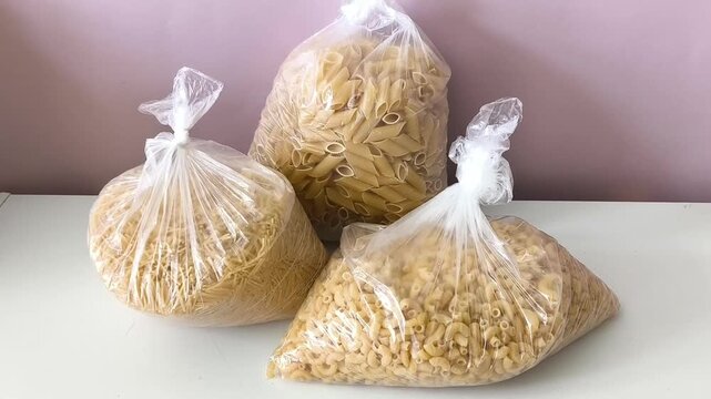 Three packets of durum wheat dry pasta on the table
