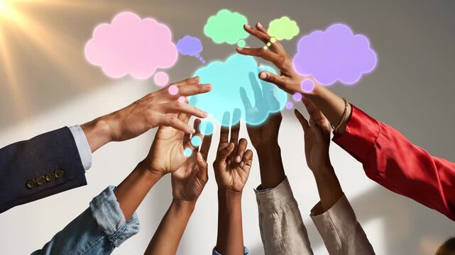 Diverse group of people reaching up towards glowing colorful thought bubbles representing teamwork and communication