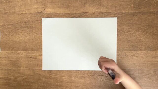 Child Hand Clicking Retractable Ballpoint Pen and Placing It on Paper in 4K Slow Motion