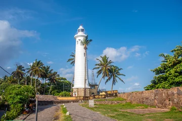 Fototapeten Leuchtturm Lighthouse on the Tropical Coast of Sri Lanka  © Sithila