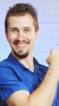 Male person makes the Fuck yea pose with arm