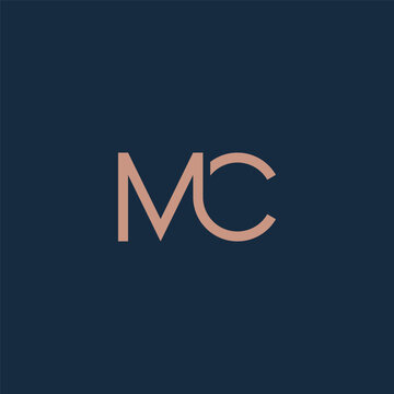 MC monogram fashion logo in gold color