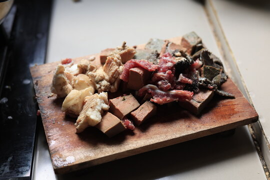 Beef offal on a chopping board, with natural lighting