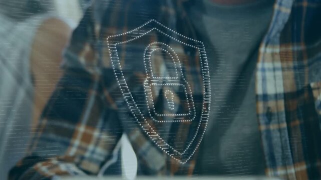 Man using tablet and tapping screen causing animated security shield over tablet securing access