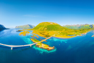 Aerial view of a bridge over a fjord in the Lofoten Islands, Norway. Scenic view of the northern summer from a drone. Norwegian arctic landscape. Transportation in Scandinavia nature. © biletskiyevgeniy