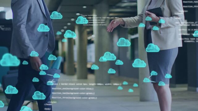 Businessman and woman approaching lobby, shaking hands while teal cloud code linking for networking