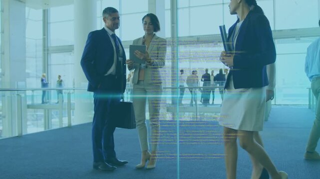 Businesswoman gesturing at tablet initiating code overlay, man holding case, peers passing atrium