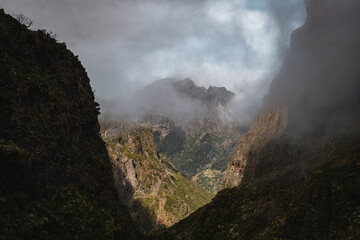 Fototapeta premium Breathtaking view of the cloudy mountains on the trail to Pico Ruivo in Madeira, Portugal