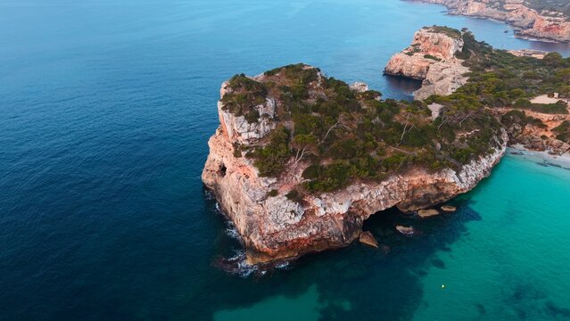 Cala des moro coastline with turquoise water and cliffs, balearic islands exploring scenery