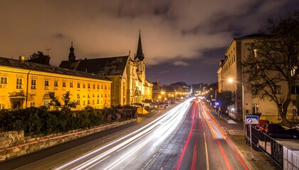 Obraz premium City street at night with traffic.