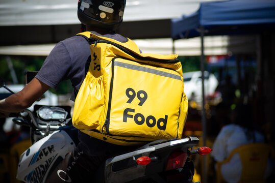 Food delivery driver on a motorcycle in traffic