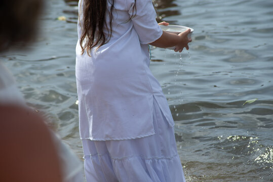 Devotees on the beach during a religious festival.