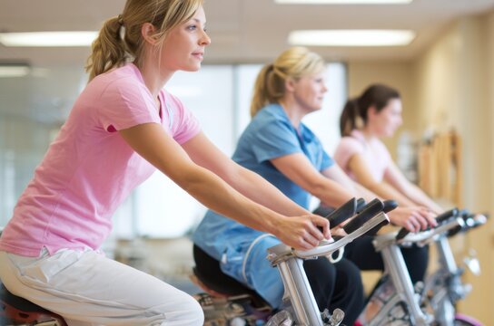 Cardiac rehab session with patients exercising on stationary bikes in a clinic
