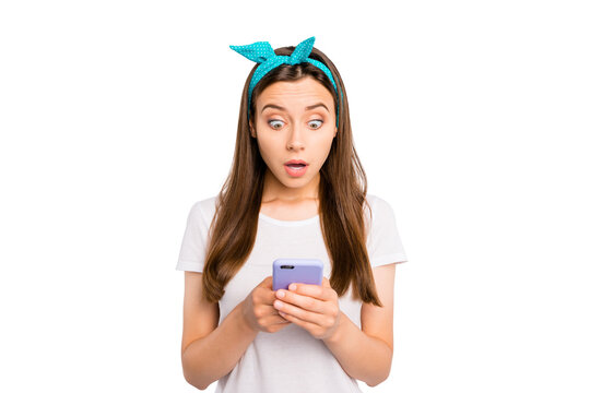 Portrait of astonished girl use her smartphone get notification read feednews stare speechless stupor wear casual style outfit isolated over white color background