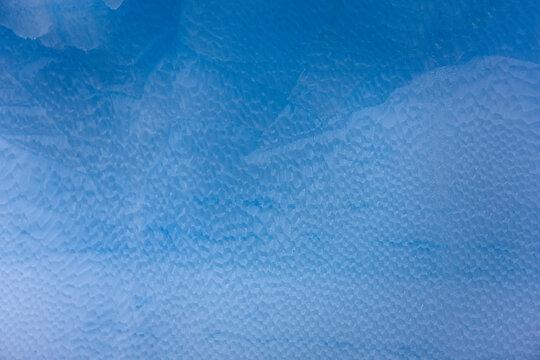 South Orkney blue iceberg on a cloudy winter day.