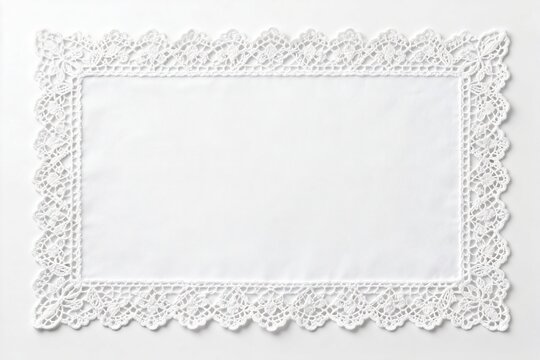 White lace doily on plain background
