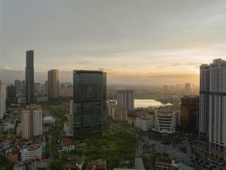 Obraz premium Night aerial panorama of Cau Giay district with illuminated skyline and busy urban streets in Hanoi Vietnam.