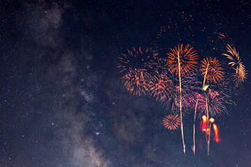 Obraz premium Fireworks with blur milky way background