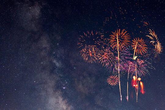 Fireworks with blur milky way background