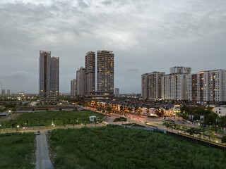 Obraz premium Modern residential towers and developing urban district at Ngoai Giao Doan area west of West Lake during cloudy evening in Hanoi Vietnam.