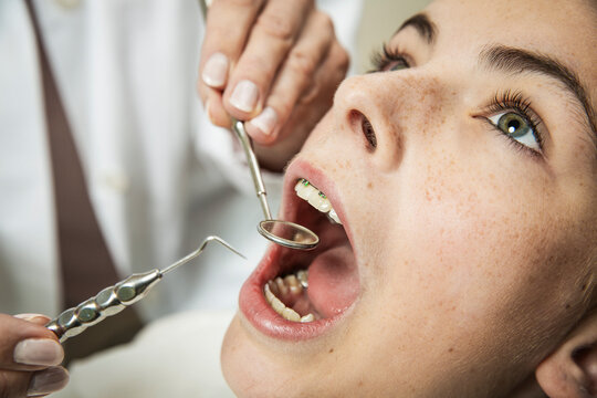 Young Woman Receiving a Routine Dental Examination