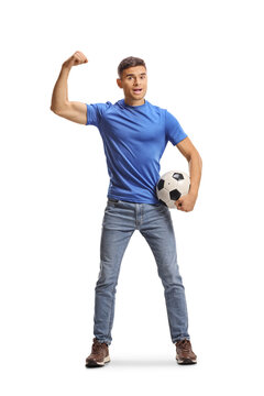 Young man in blue shirt flexing arm and holding a football