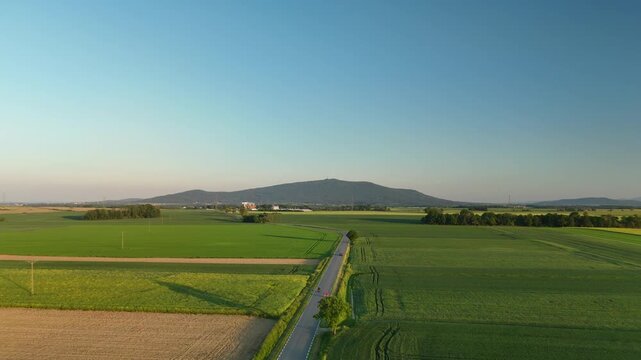 Aerial View of Ślęża Mountain and Rural Landscape in Poland at Sunset