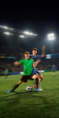 Naklejka premium Soccer opponents fighting for possession with motion blur on stadium field. Concept of football tactics, defensive training, match promo, sports news graphics and gear campaign.