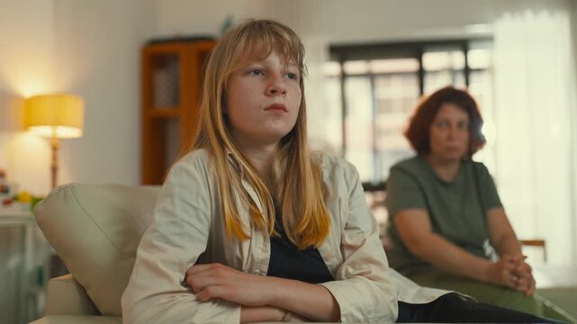 Rebellious teenager talking to her worried mother