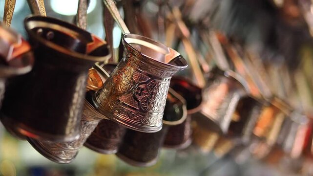 Traditional Ornate Turkish Coffee Pots Hanging in a Market
