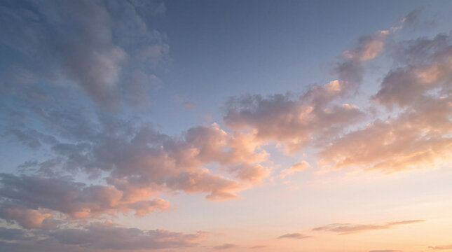 Dramatic sunrise or sunset sky with vibrant blue and warm orange-pink clouds.