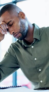 Office, document and black man with stress, reading and bad news on paperwork or real estate fail. Property investor, anxiety and headache with rejected loan application, strain or overworked crisis