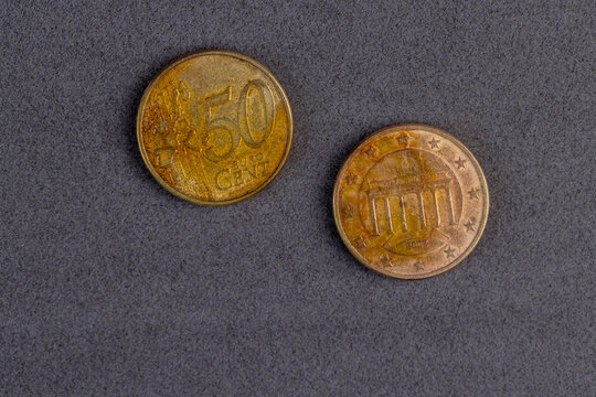 old damaged European Union metal coins with a face value of 50 cents, close up
