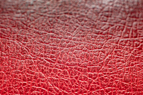 Macro texture of red faux leather background