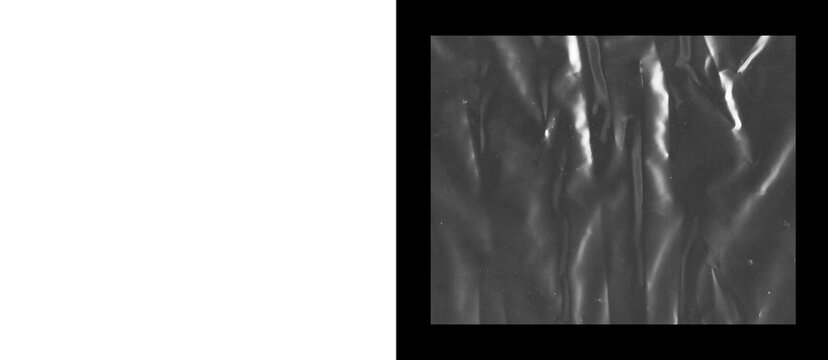 Crumpled black plastic texture, wrinkled dark polyethylene film background, abstract shiny synthetic material with creases and highlights