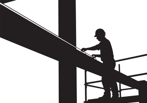 Silhouette of construction worker on scaffolding
