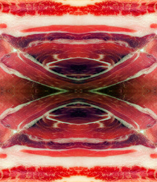Symmetrical abstract texture pattern made from a macro photography slice of Spanish jamon serrano ham