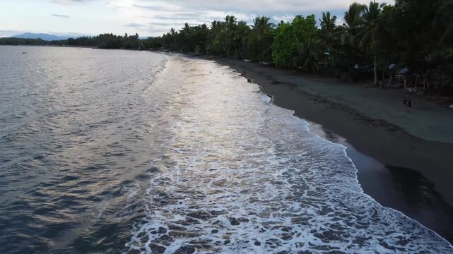 Drone aerial footage of Cantilan in Mindanao, Philippines featuring tropical coastline, river, ocean water, forest, lush jungle and natural island landscape.