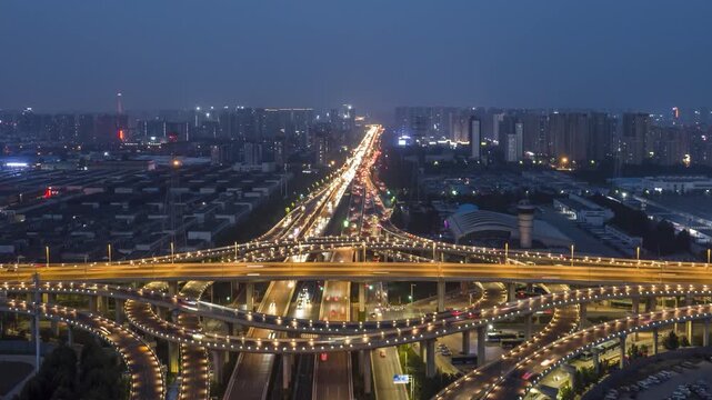 Night aerial orbit time lapse of urban overpass in China
